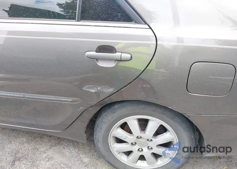 2003 Toyota Camry Xle z USA, uszkodzony, nr VIN 4T1BE30KX3U769921